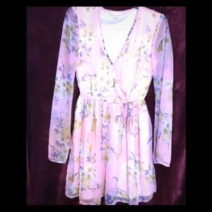 Romantic dress offering soft pastel floral print.